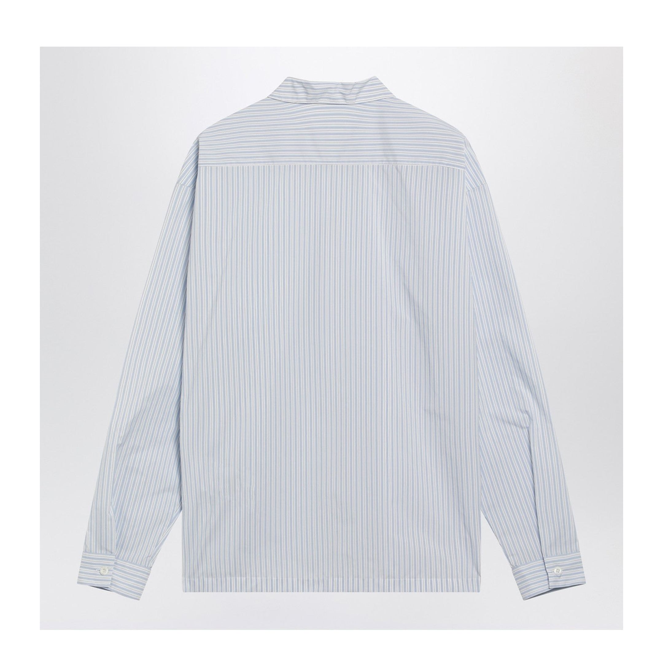 White and light blue striped zip-up shirt