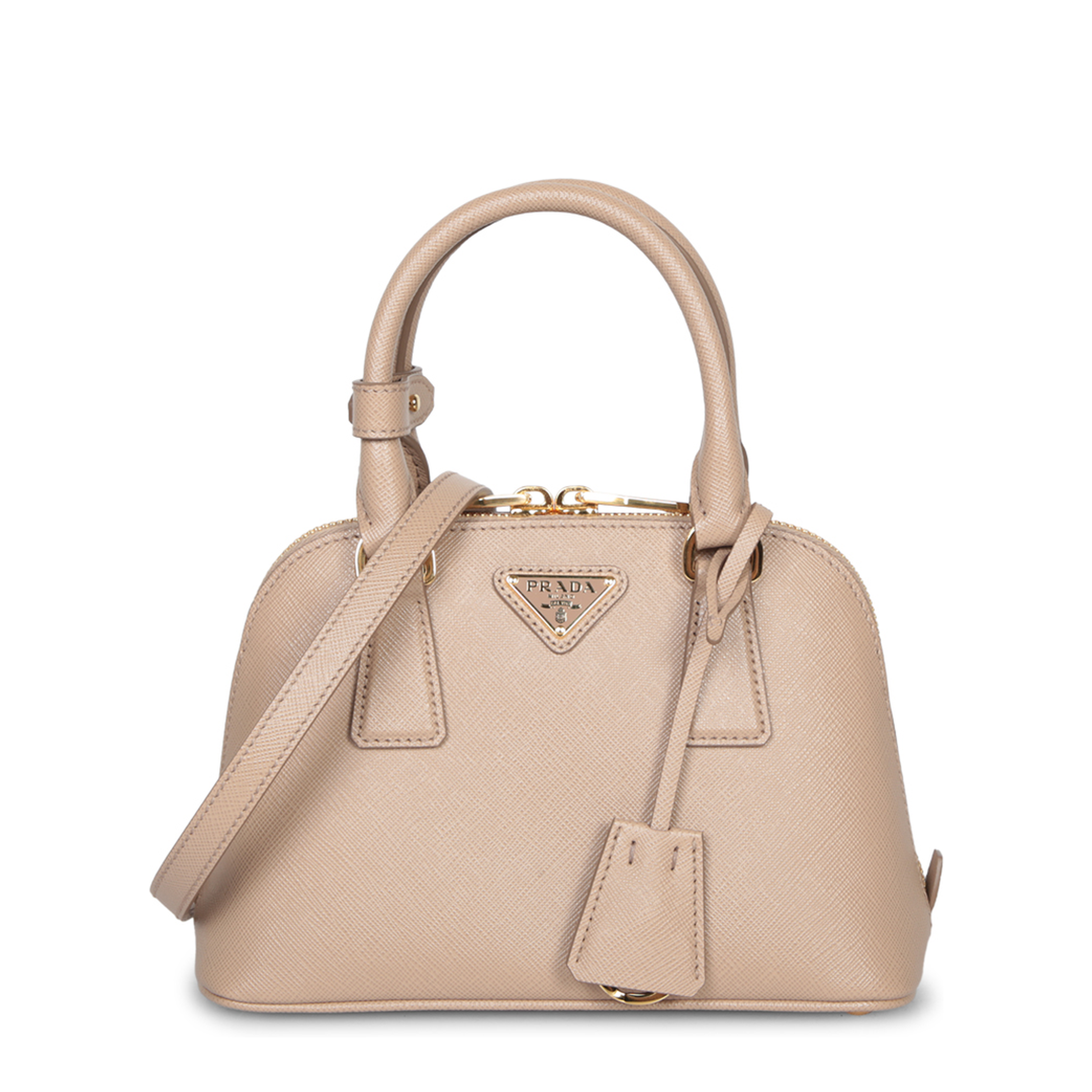 Crafted from Saffiano leather. Features top handles and an adjustable shoulder strap. Top zip closur