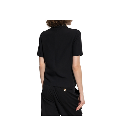 Top with applications on the collar