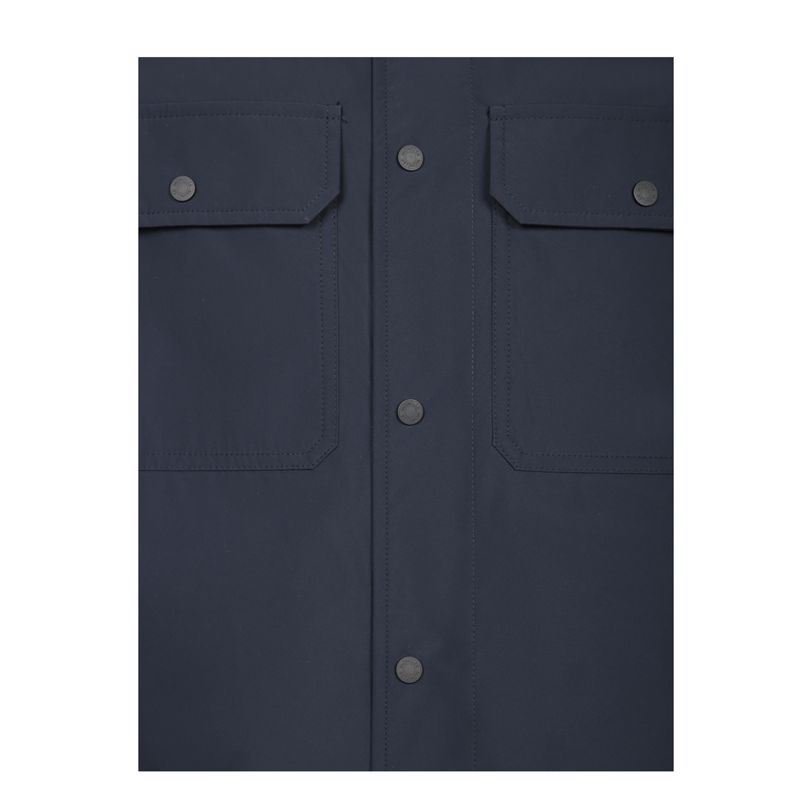 Long sleeves, double front flap pockets, button closure.