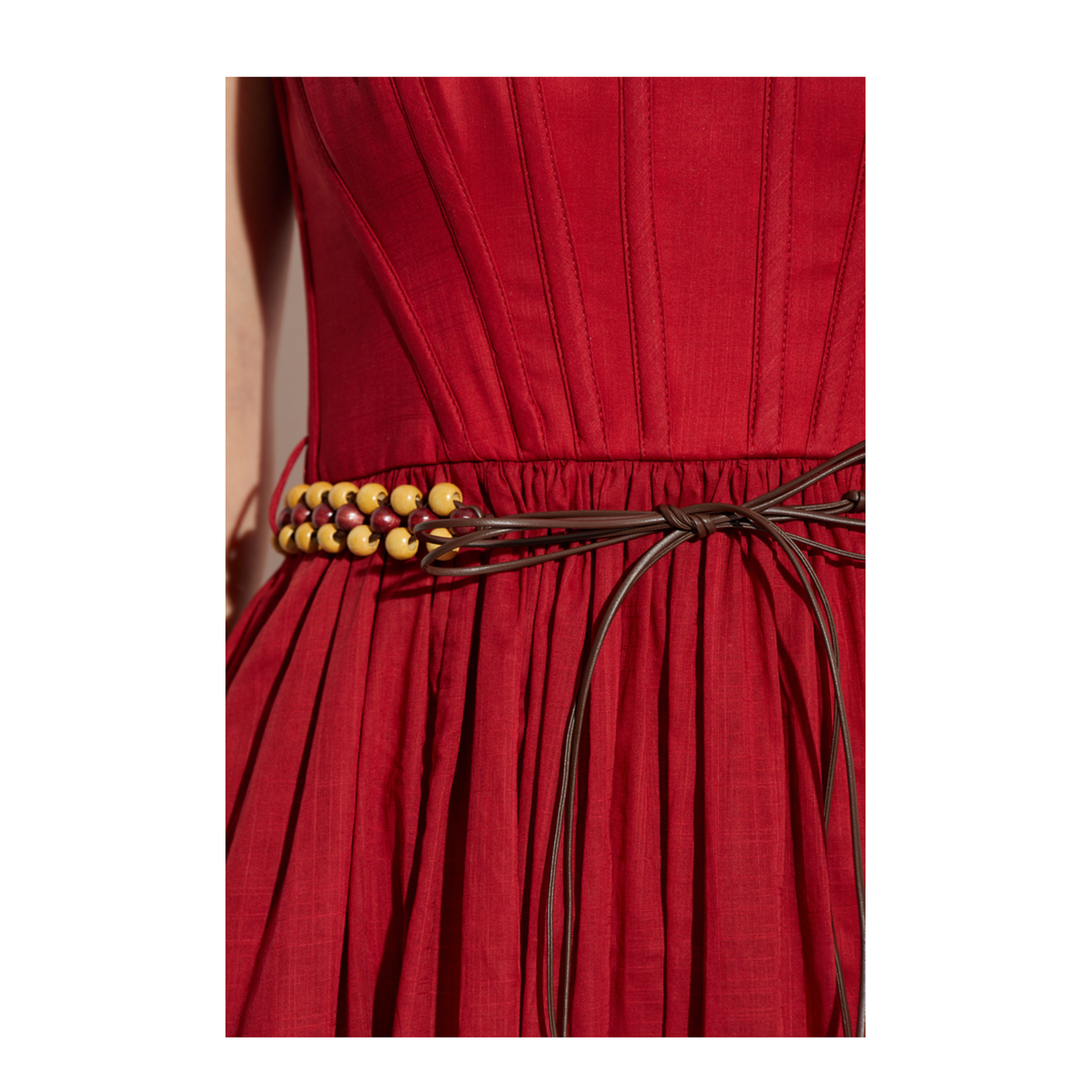 Dress with a beaded waist belt