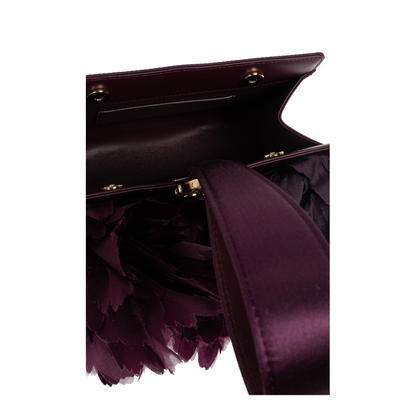 Handbag with appliqués
