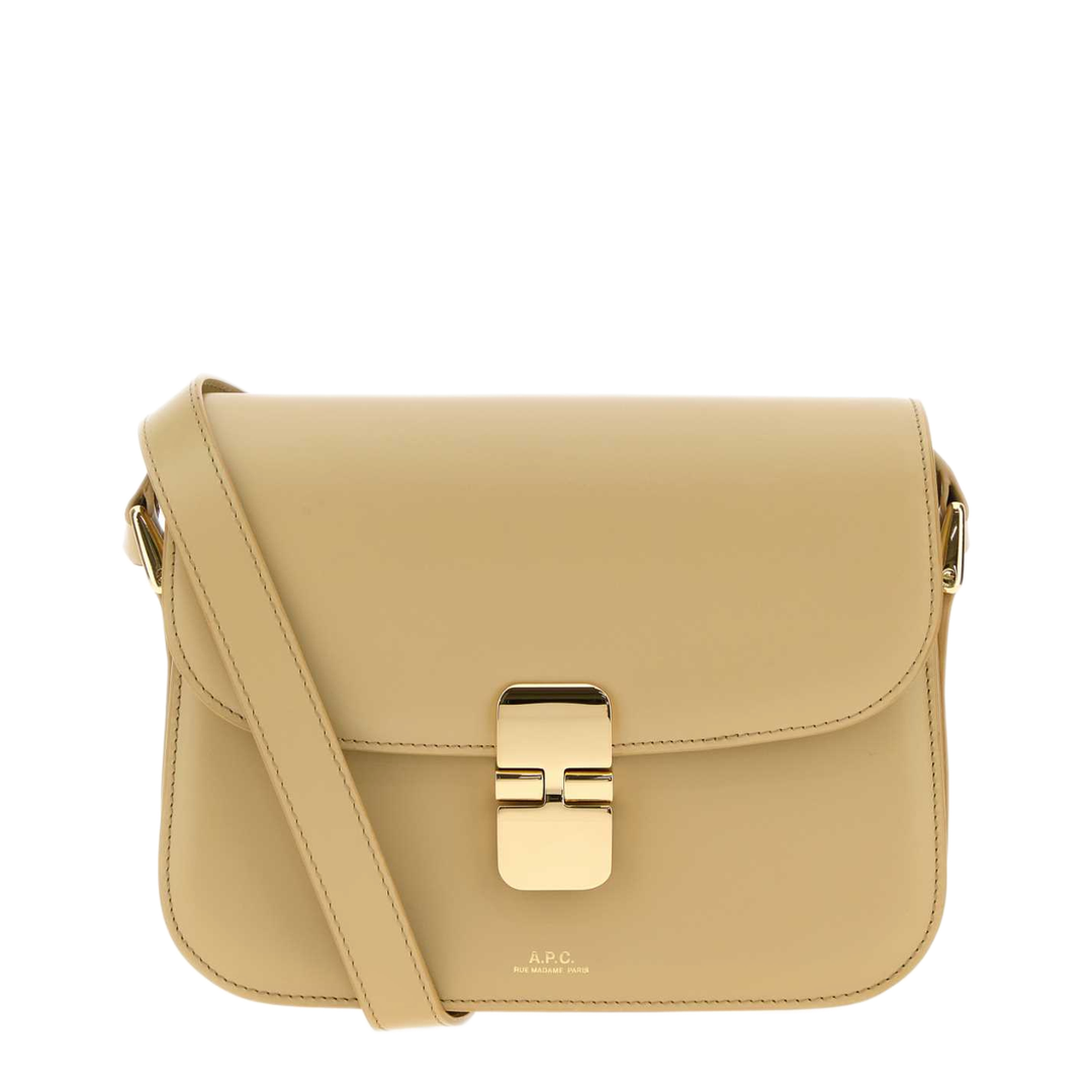 Beige A.P.C. Grace Small bag showing its curved flap, gold-tone clasp and narrow matching strap.