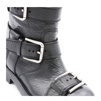 Black leather boots with straps