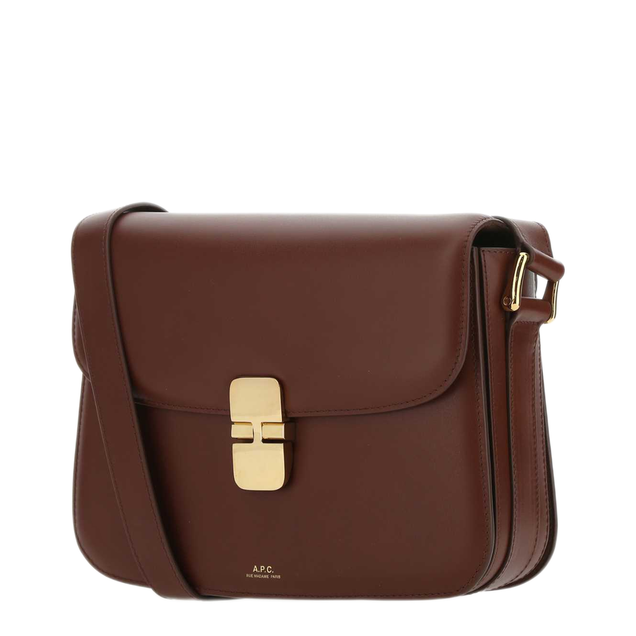 Angled view of a brown A.P.C. Grace bag showing the rounded flap, matching strap and gold-tone clasp.
