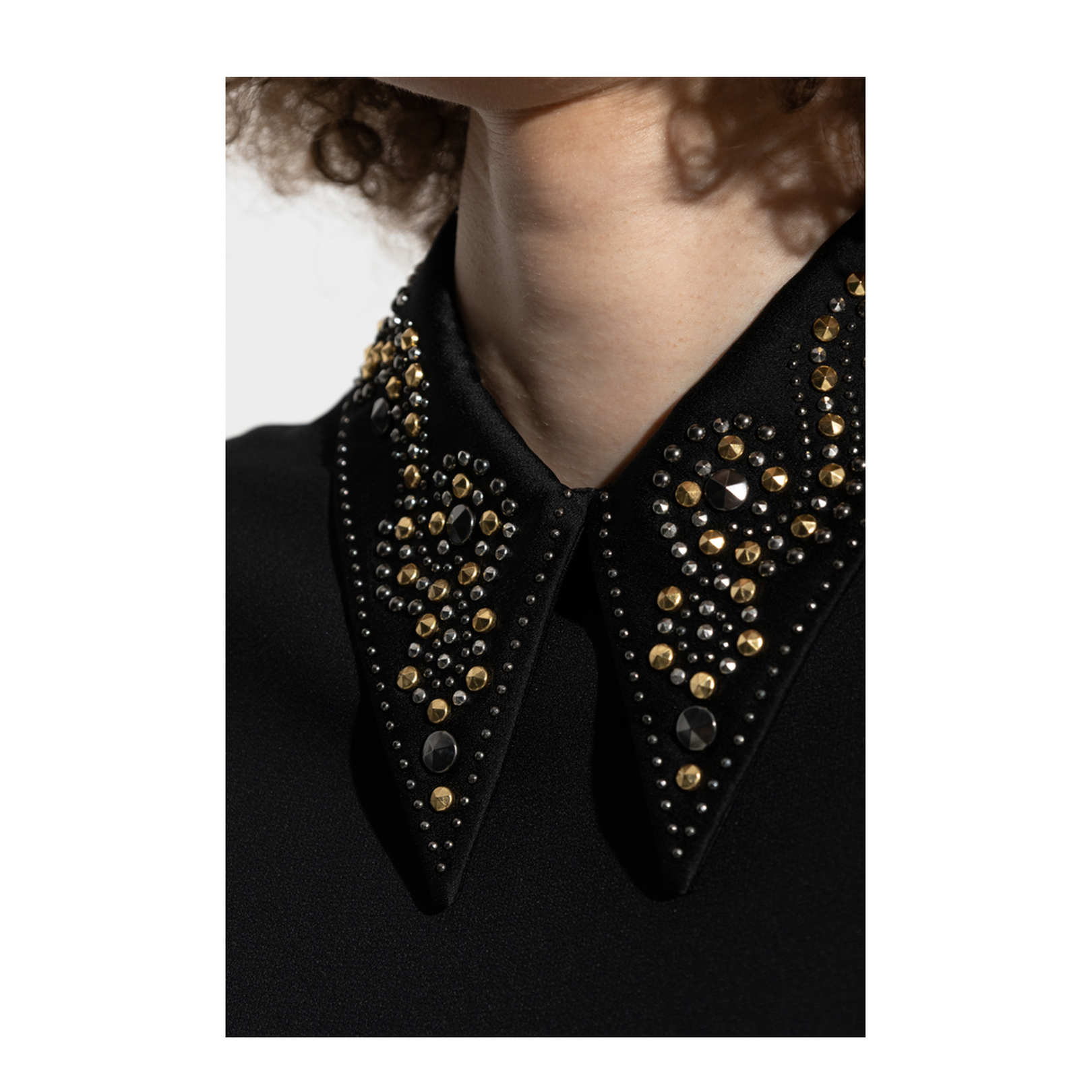 Top with applications on the collar