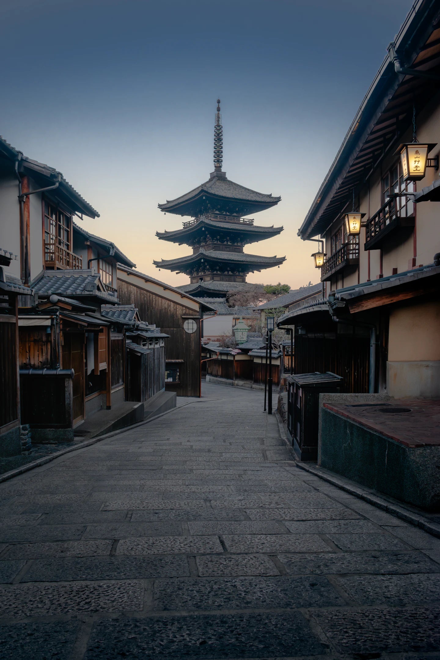 Yasaka Pagoda rising above a quiet traditional Kyoto street at sunrise